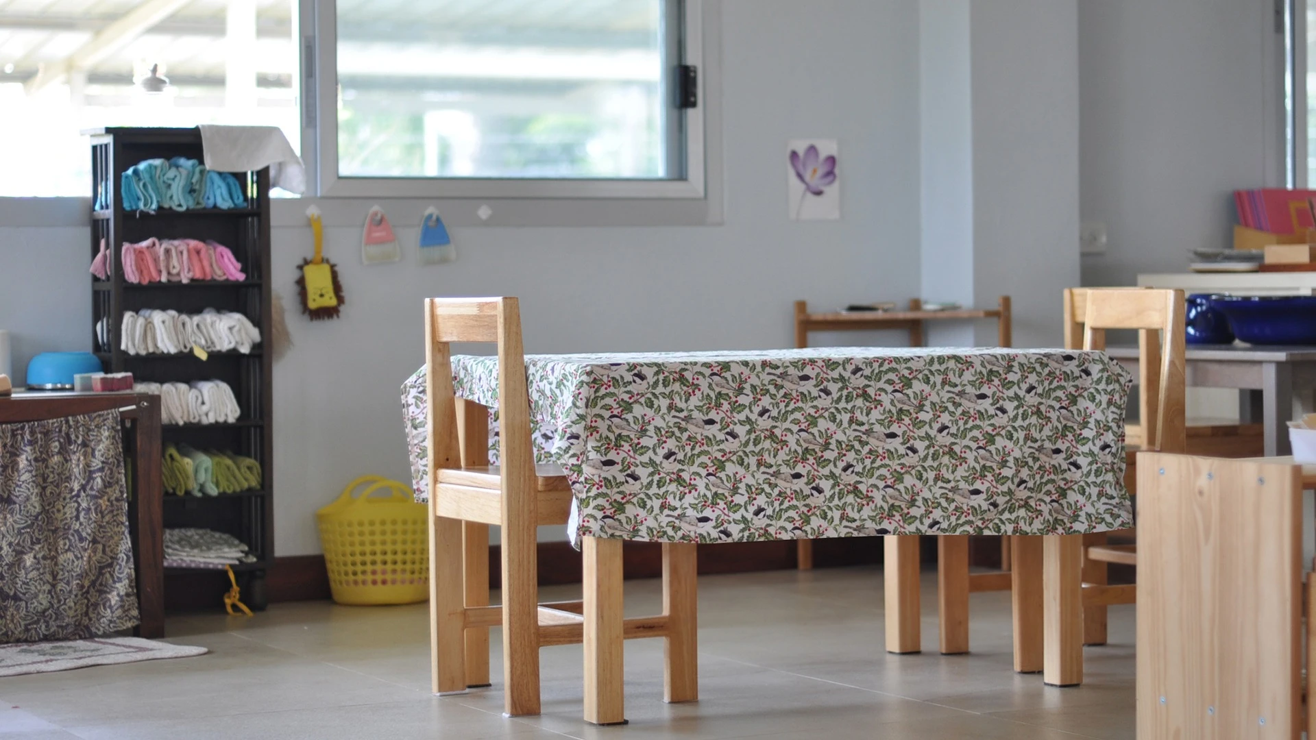 Small wooden chairs and a table prepared for children